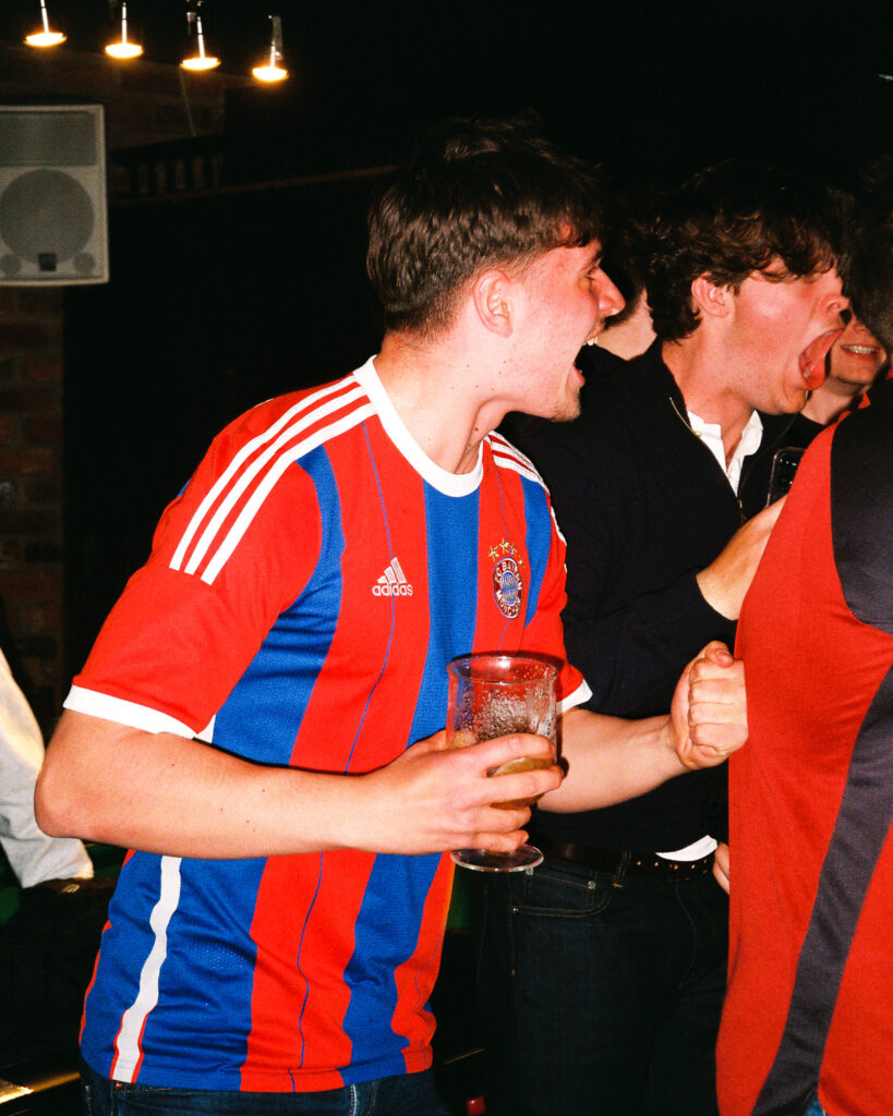 Bayern Munich fan celebrating a goal at the famous three kings in west kensington