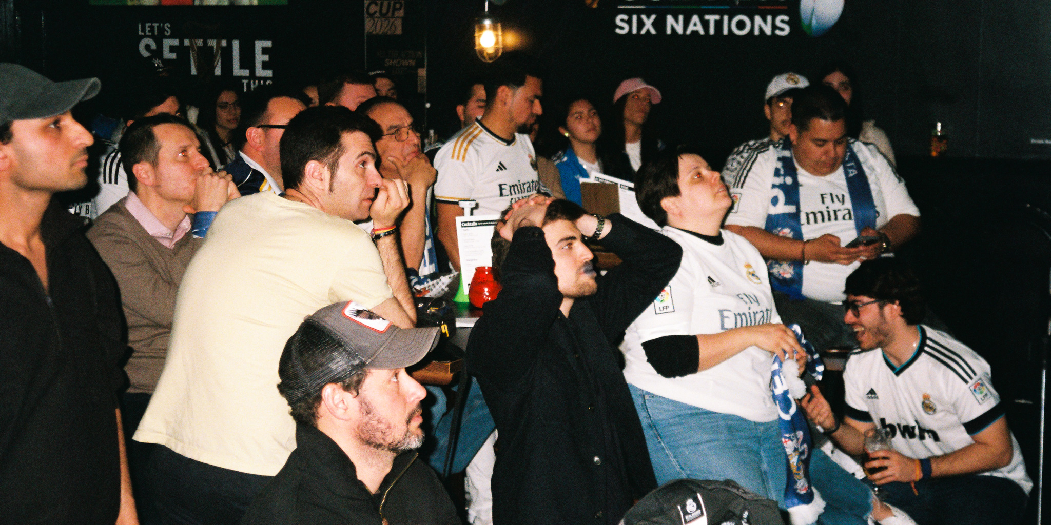 fans watching football at the famous three kings in west kensington